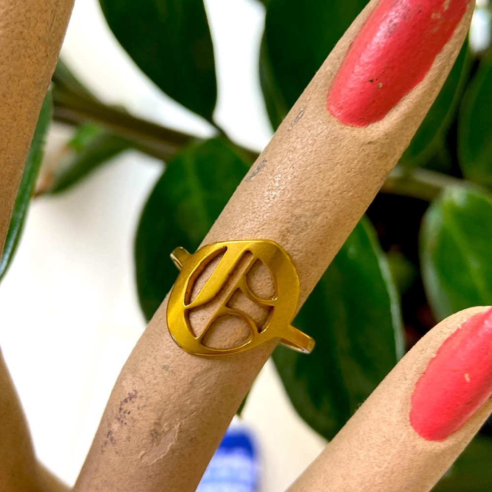 Old English Letter adjustable ring . Gold tone.